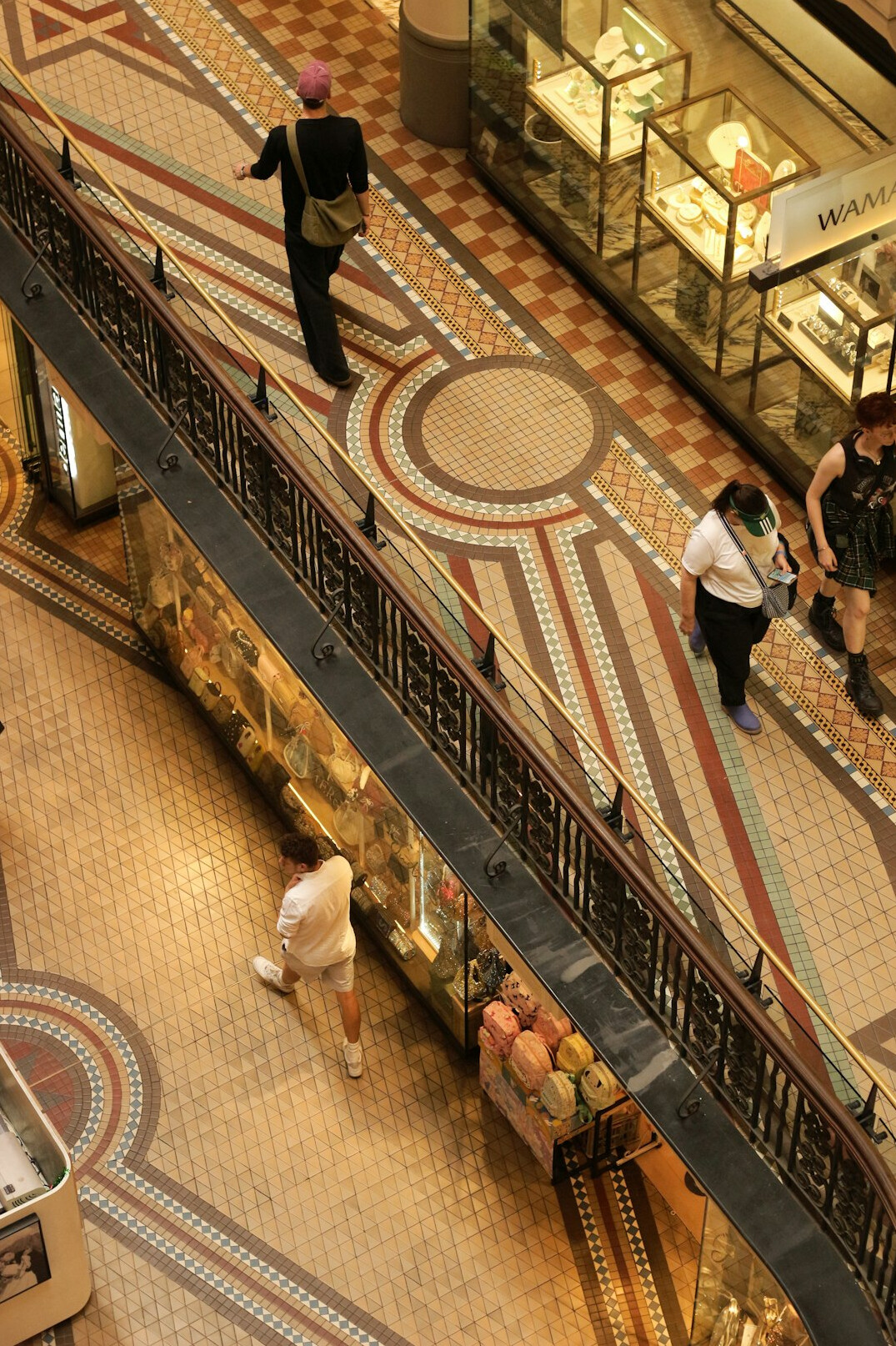 Retail staff member coordinating with a walkie-talkie on the shop floor