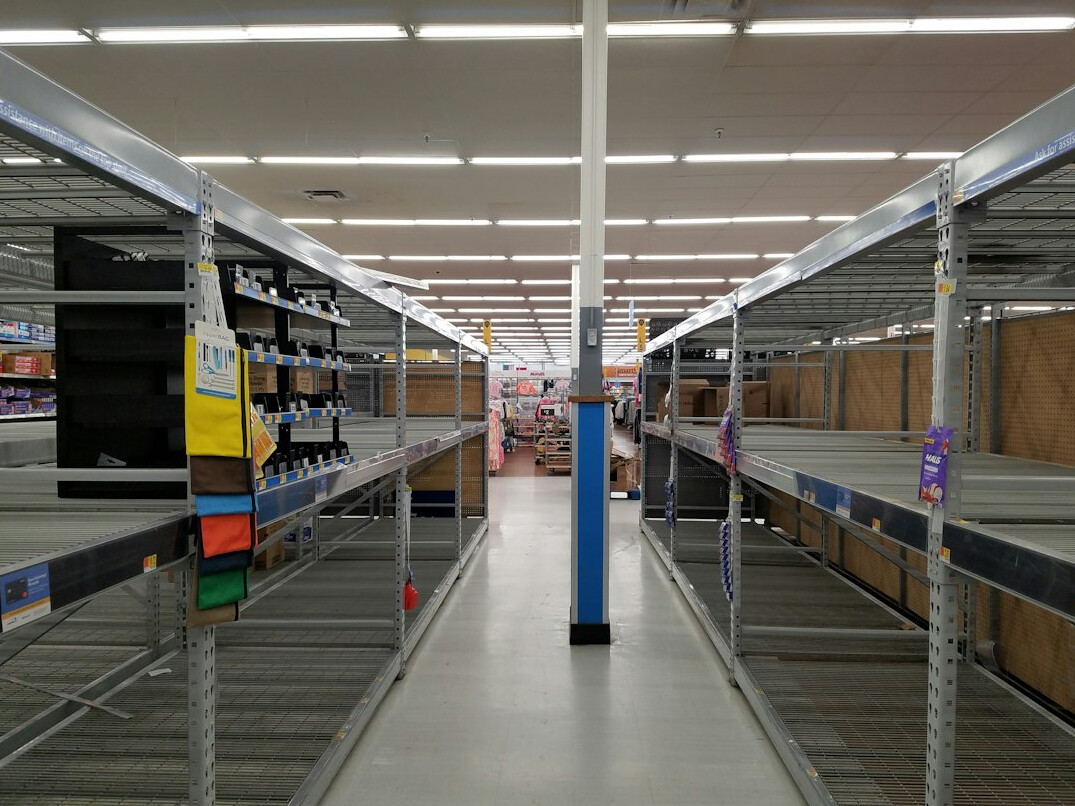 Wide shot of a modern empty retail store interior with clean aisles